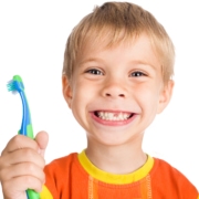 smiley boy without one teeth with toothbrush isolated on white b
